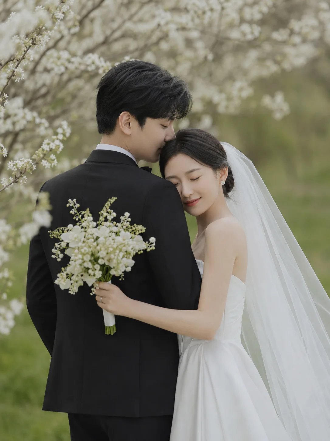 AI-generated portrait of a wedding couple beneath blossoming trees in soft light.